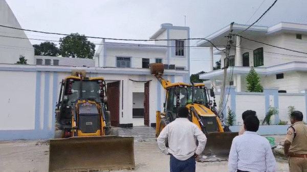 Bulldozers roared on the house of the village head